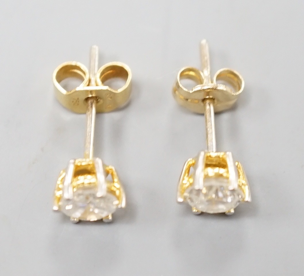 A pair of yellow metal and solitaire diamond set ear studs, gross weight 1.2 grams, each stone weighing approx. 0.33ct.